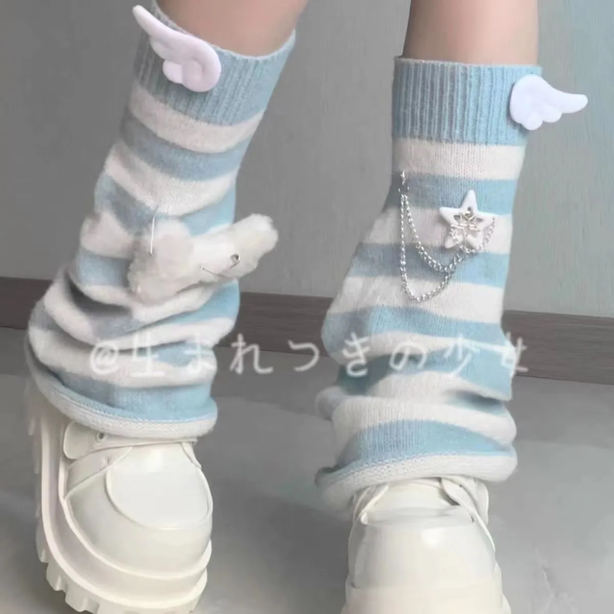 Subculture aqua striped flared leg warmers